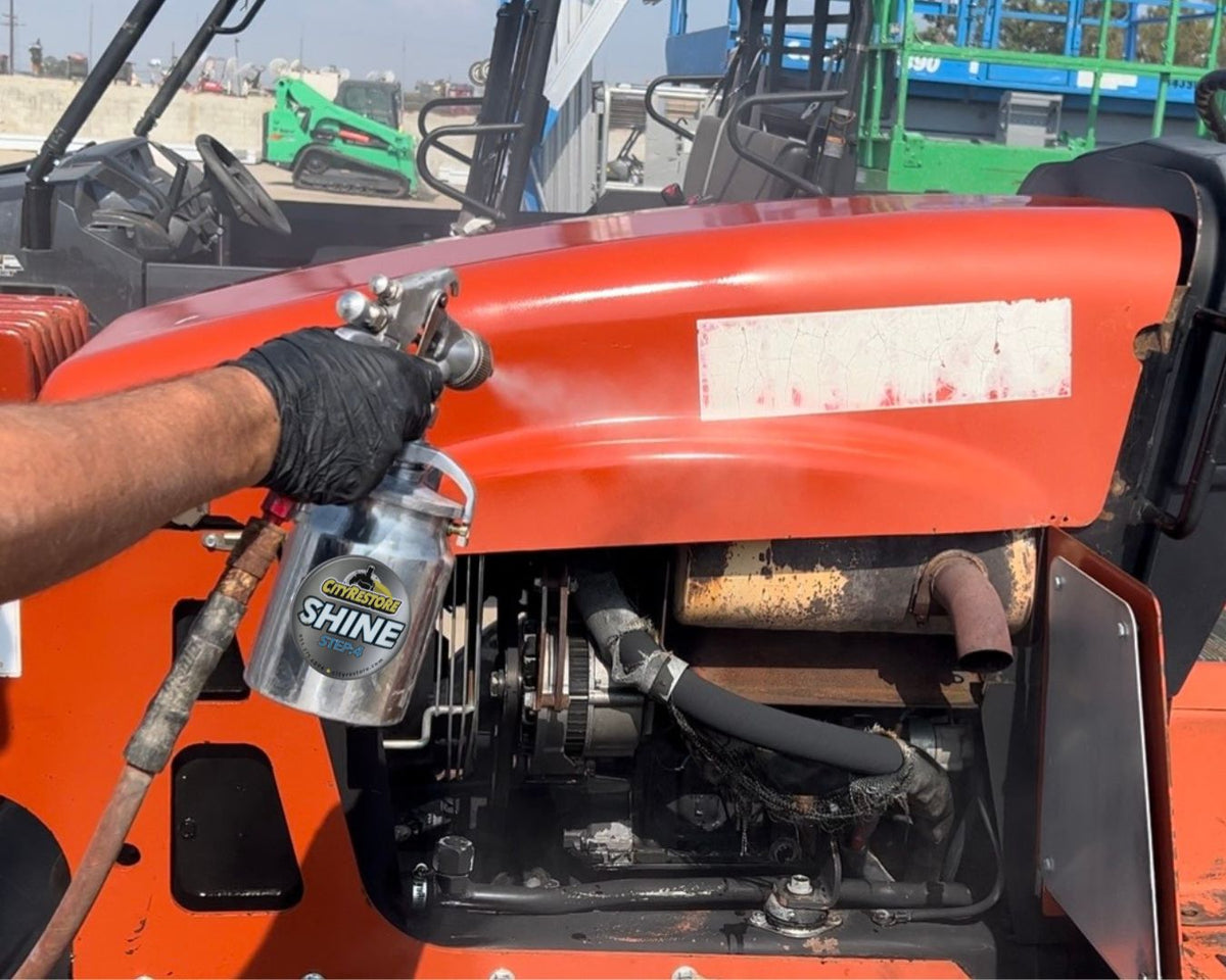 Applying City Restore SHINE step 4 to restored equipment with the included siphon sprayer